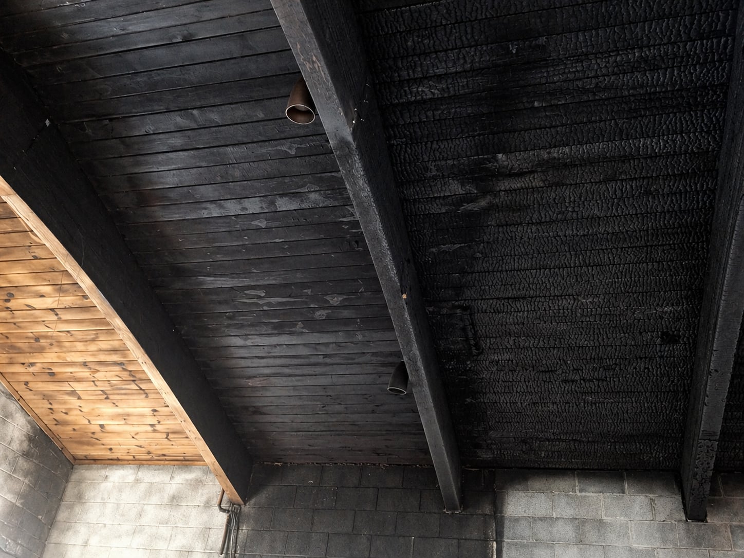Fire damaged charred wood before restoration
